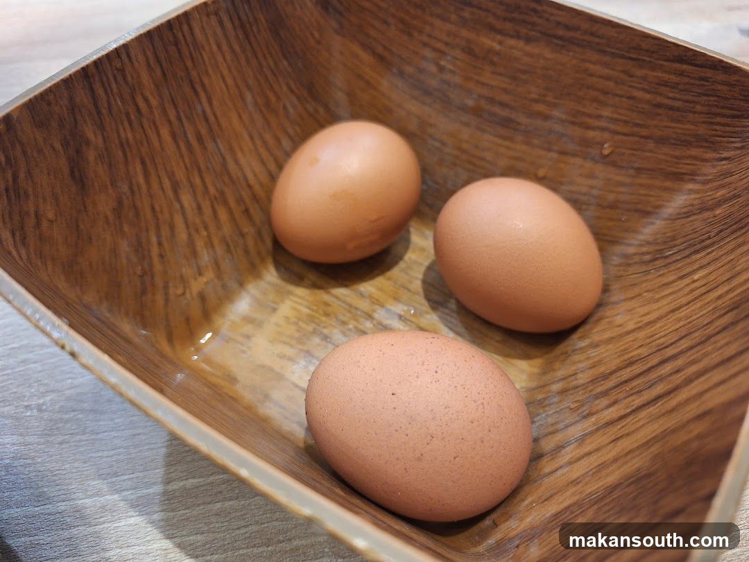 Eggs in wooden bowl