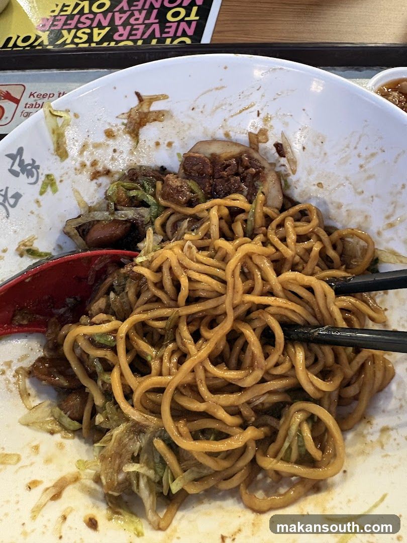 Noodle Bowl with Chopsticks and Spoon