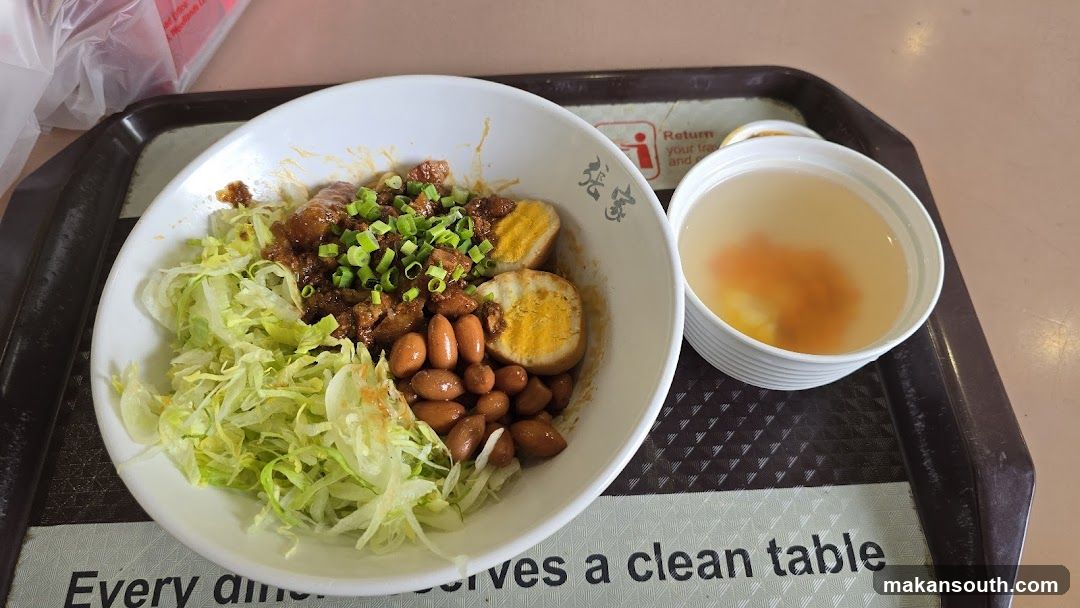 Bowl of food with side dish on tray
