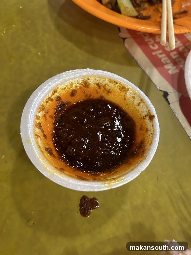 Sauce in a small cup on a table