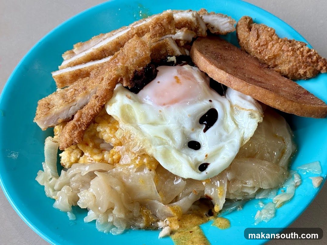 Chicken Rice Bowl with Fried Egg and Sausage