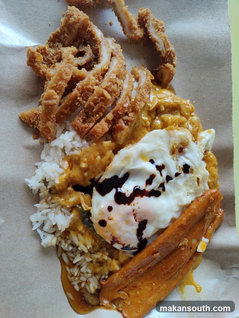 Fried Chicken Rice Dish with Curry and Egg