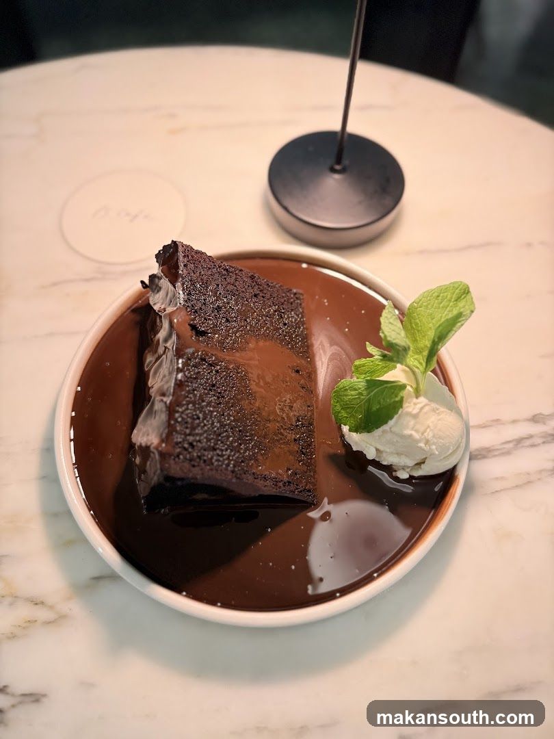 Chocolate dessert with ice cream and mint