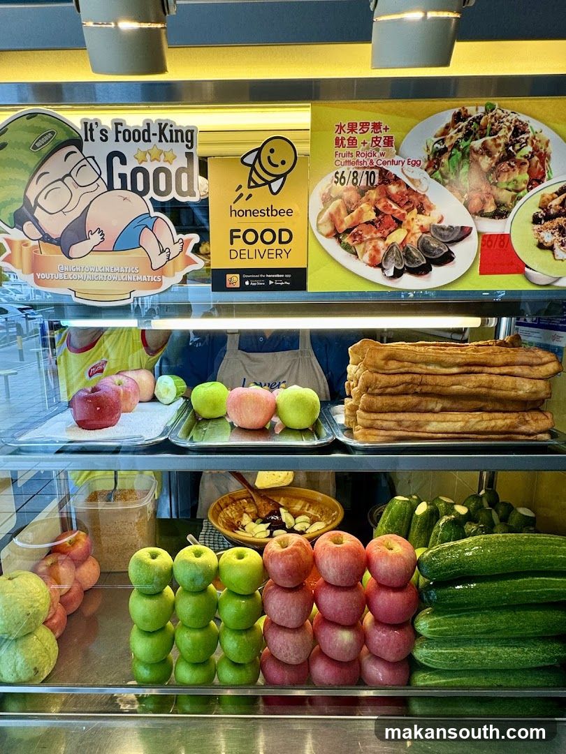 Food display with fresh produce and fried dough sticks
