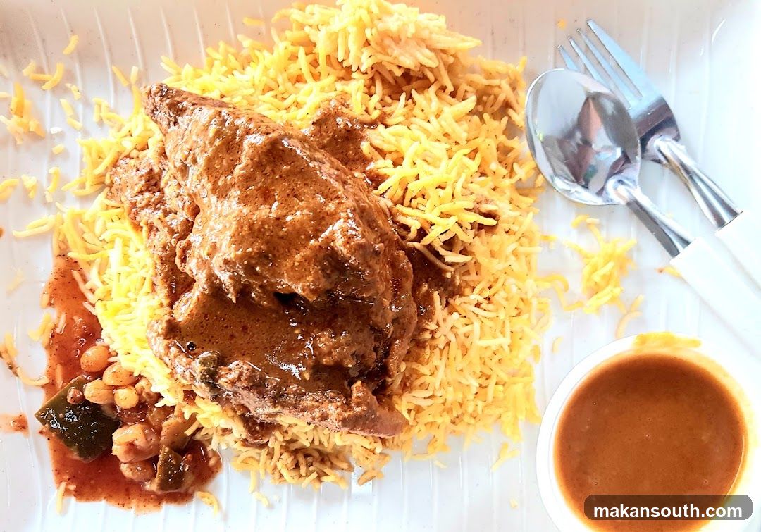 Chicken Biryani with Curry and Side Dishes