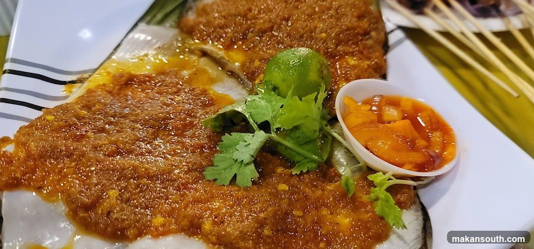 Spicy Fish Dish with Curry Sauce and Pickled Fruits
