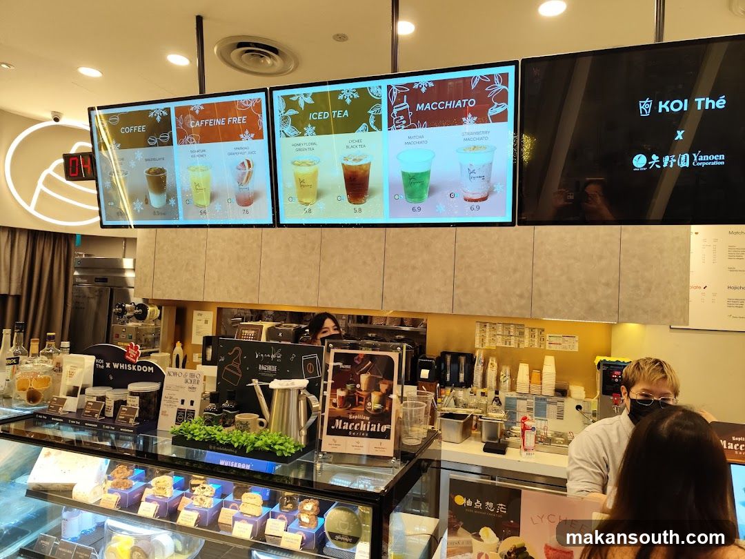 Coffee Shop Interior with Menu Boards and Staff