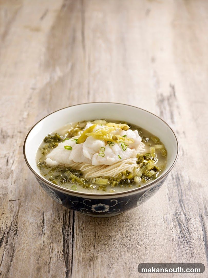 Bowl of Noodle Soup with Fish and Greens