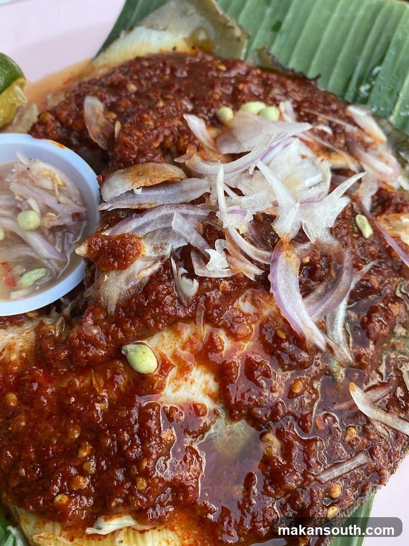Spicy Fish Dish with Onions and Sauce