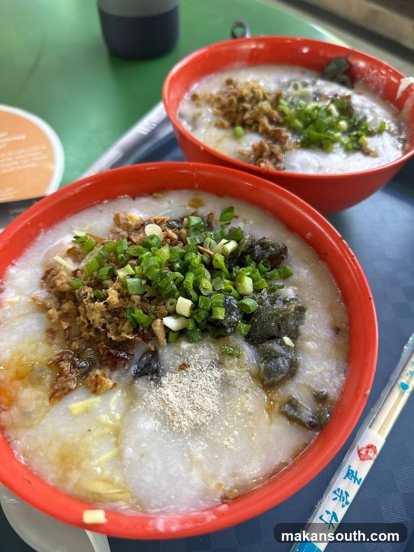 Two bowls of congee with toppings