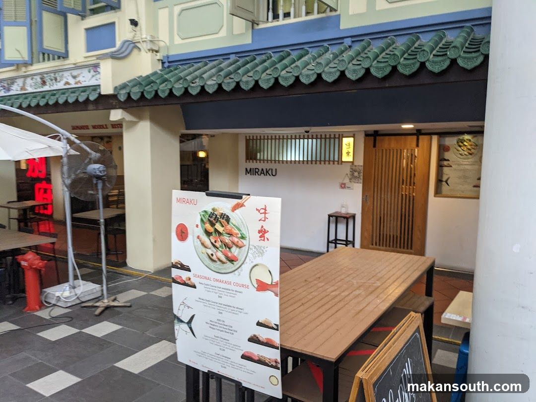 Outdoor Dining Area with Menu Board