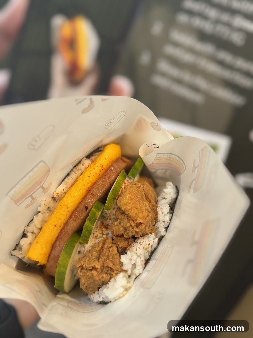 Korean-style rice wrap with fried chicken and vegetables
