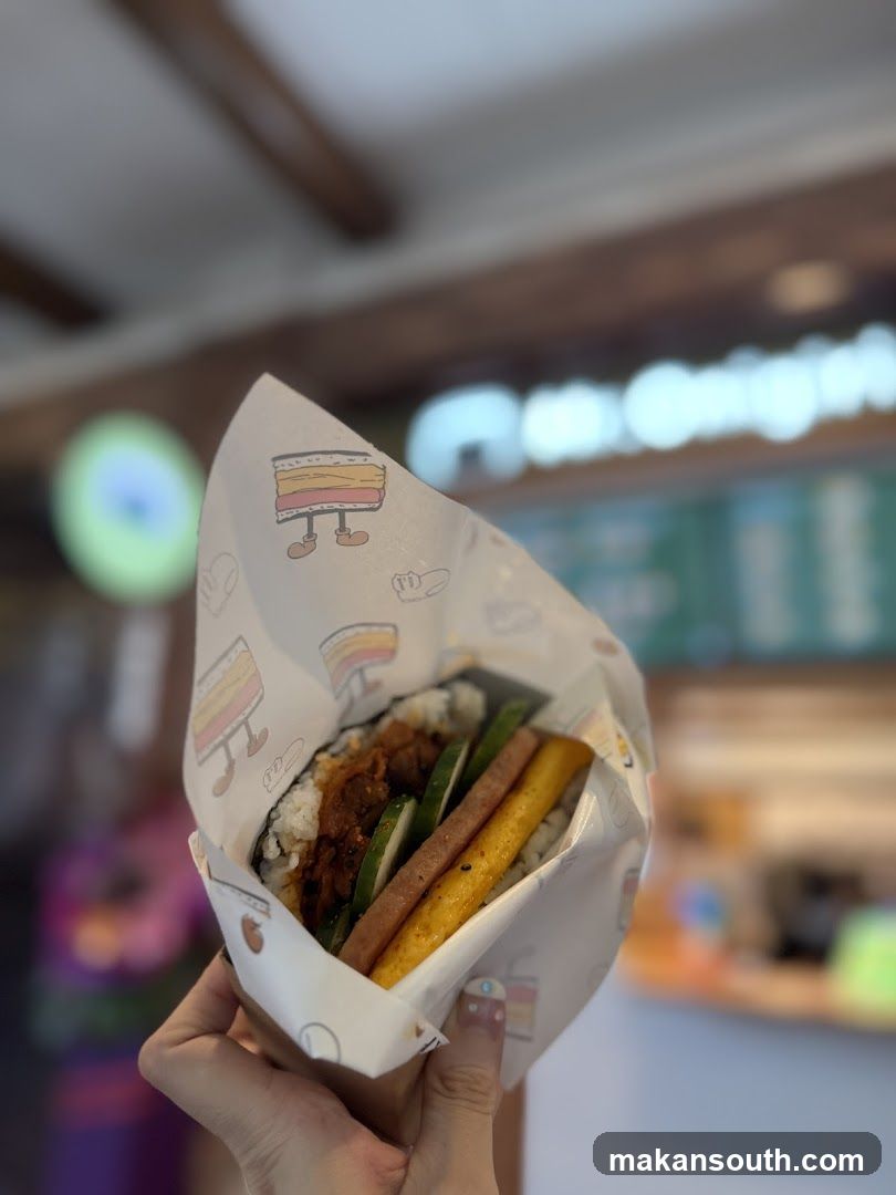 Handheld food item in paper wrap