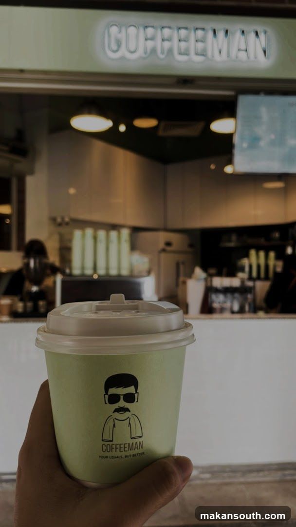 Coffee Shop Interior with Cup in Foreground