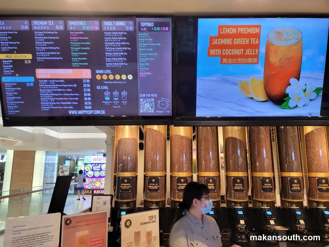 Beverage Shop Interior with Menu Board and Staff