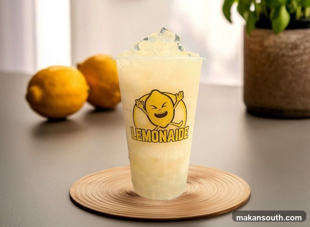Lemonade Drink with Lemons in Background