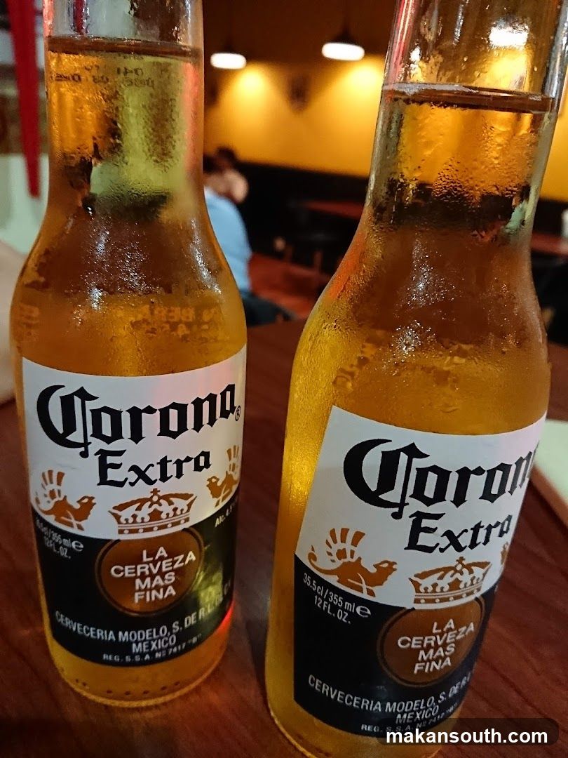 Corona Extra Bottles in a Bar Setting