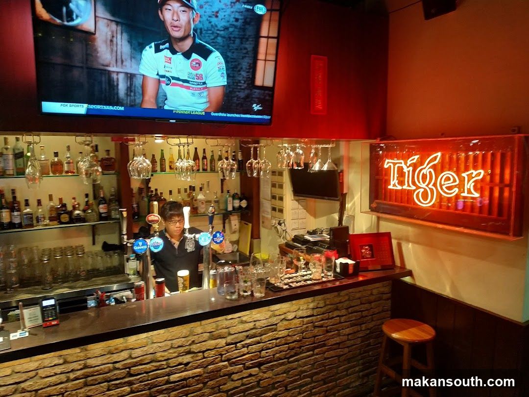 Bar Interior with TV and Neon Sign