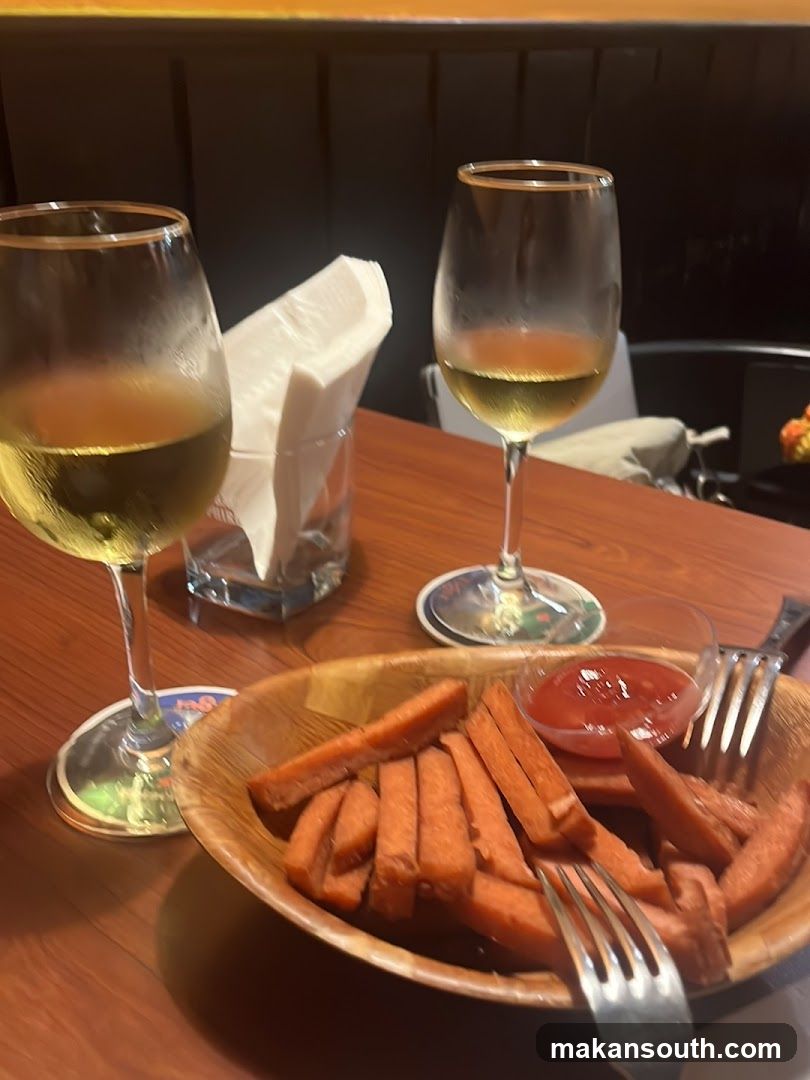Dining Table with Wine and Sweet Potato Fries