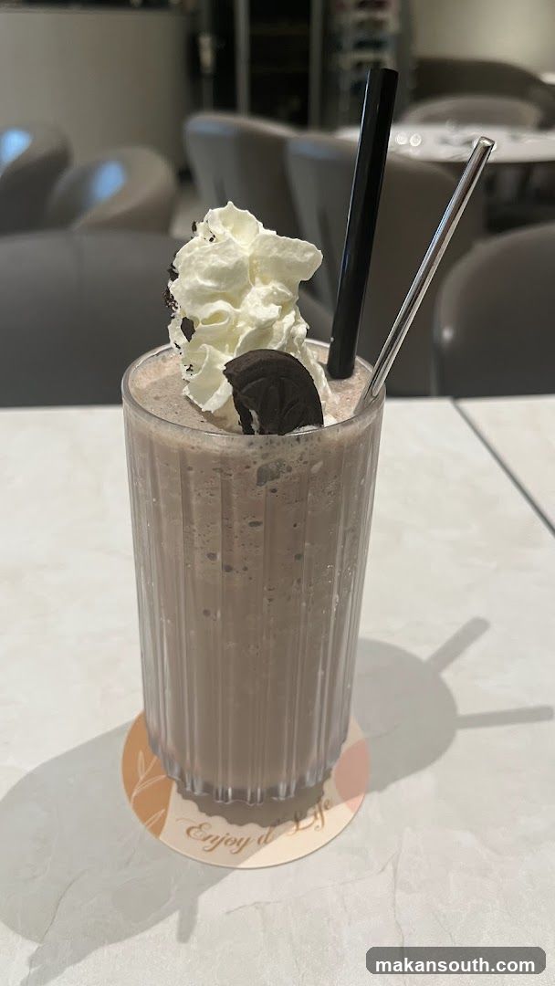 Chocolate Milkshake with Whipped Cream and Oreo Cookie