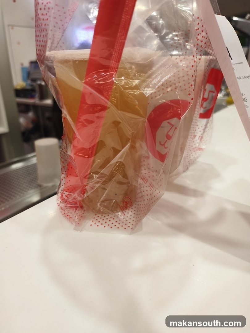 Beverage in branded bag