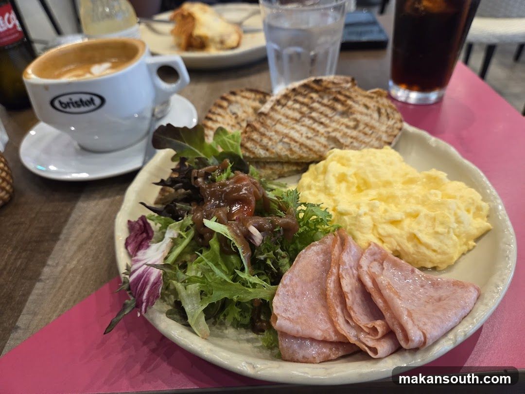 Breakfast Plate with Scrambled Eggs, Ham, Salad and Toast