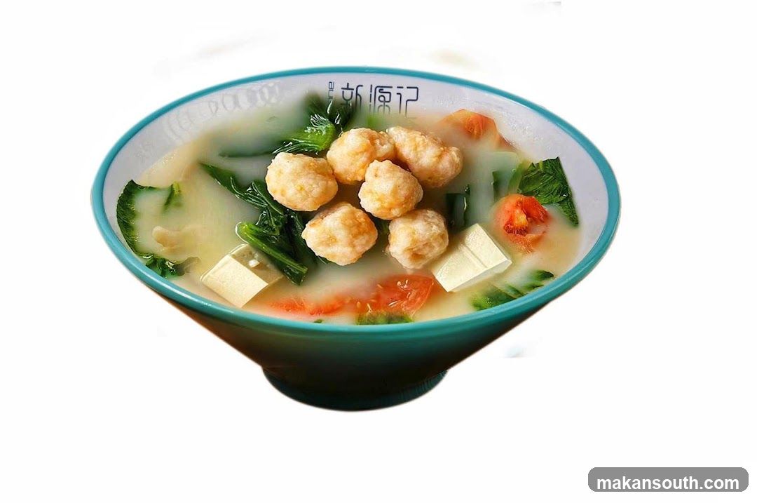 Bowl of Soup with Meatballs and Vegetables