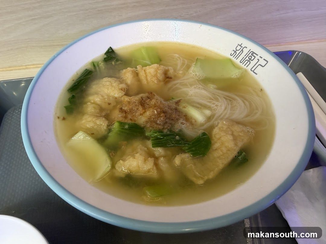 Bowl of Noodle Soup with Broth and Vegetables