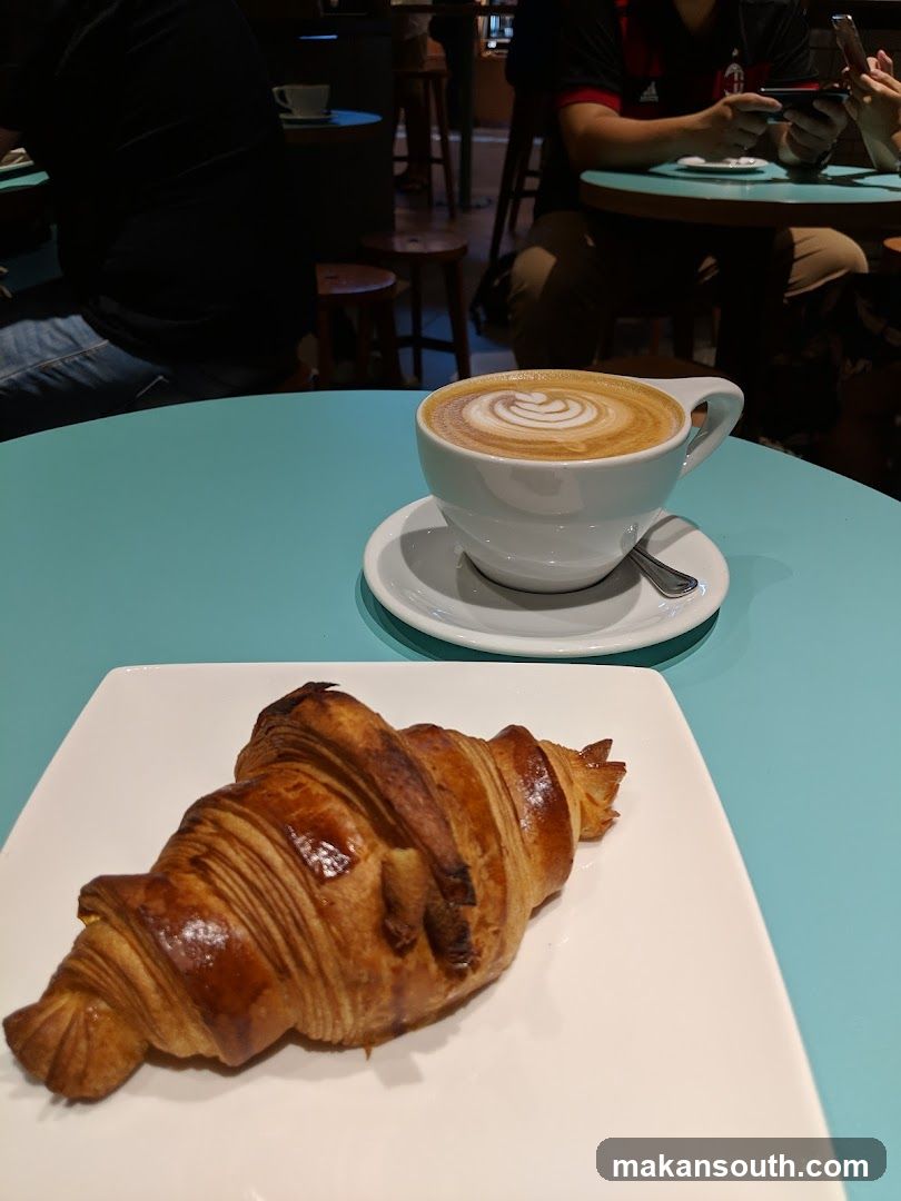 Croissant and Latte in Cafe