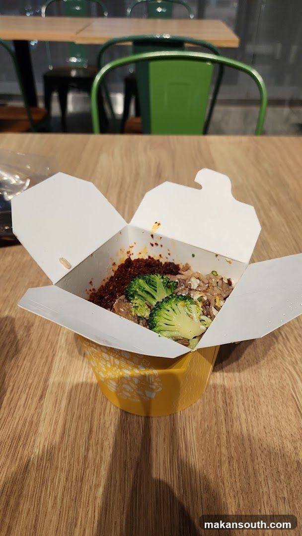 Takeout Food Container with Broccoli and Rice