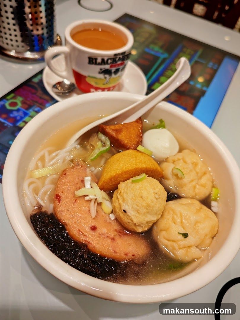 Bowl of Noodle Soup with Black Coffee