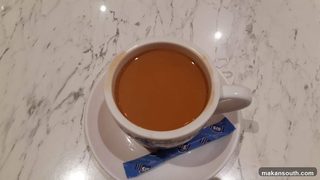 Cup of tea with sugar packets
