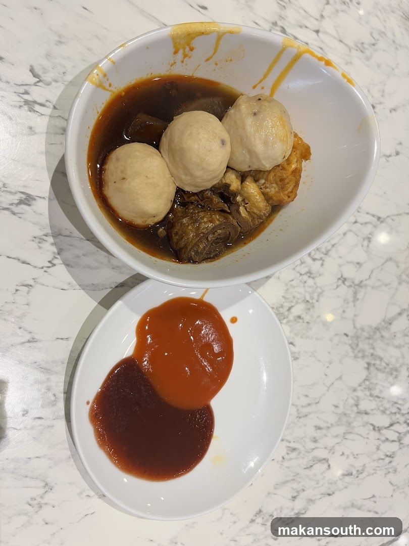 Bowl of Meatballs in Broth with Sauces
