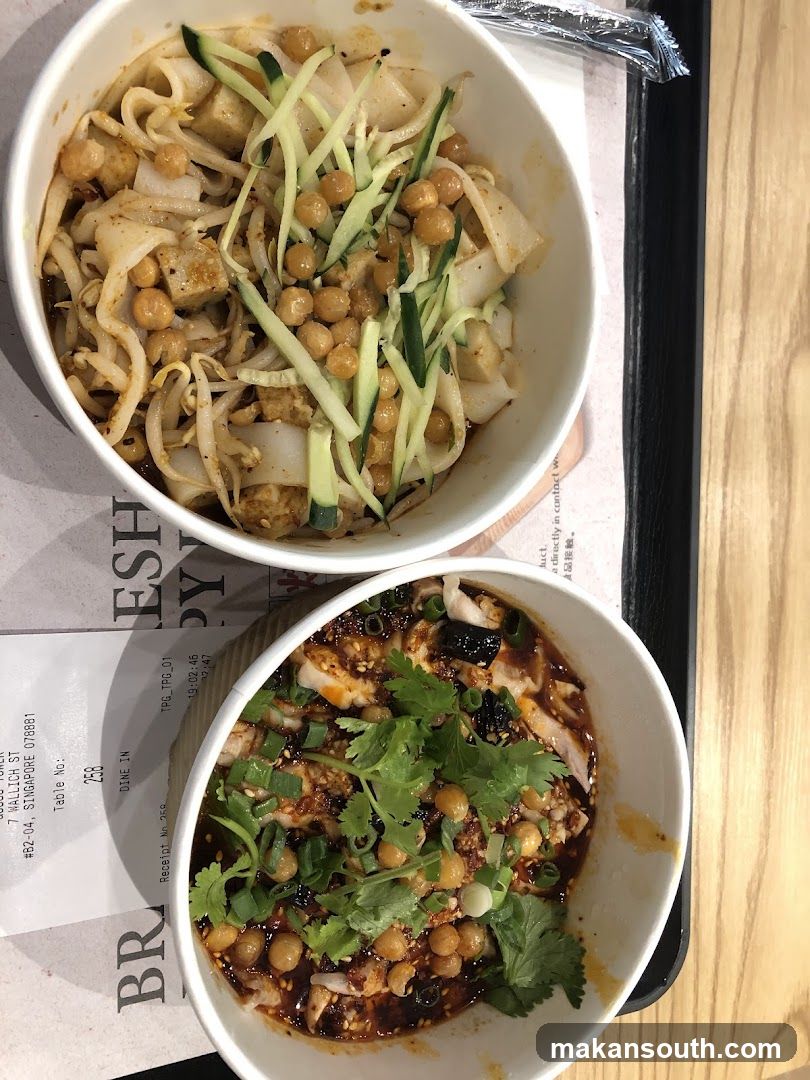 Two bowls of food on a tray