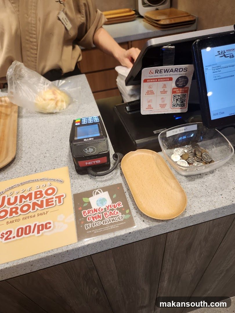 Checkout Counter with Payment Terminal and Flyers