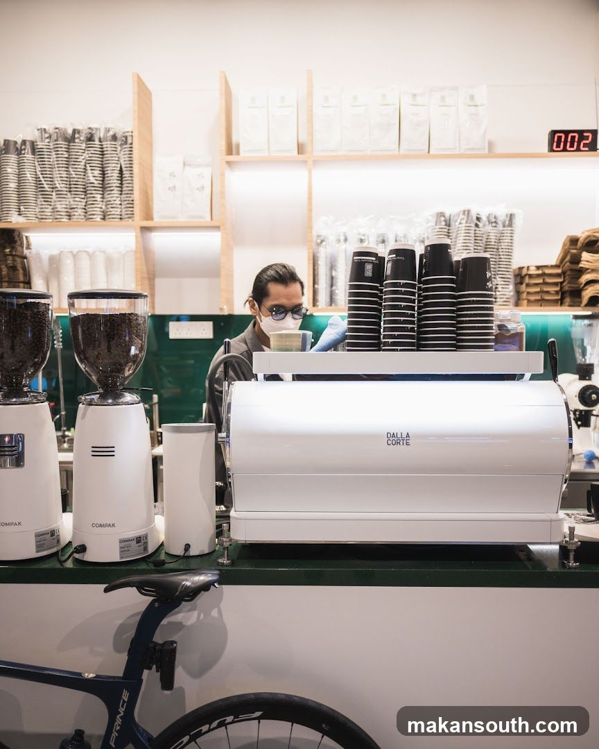 Coffee Shop Interior with Barista and Equipment