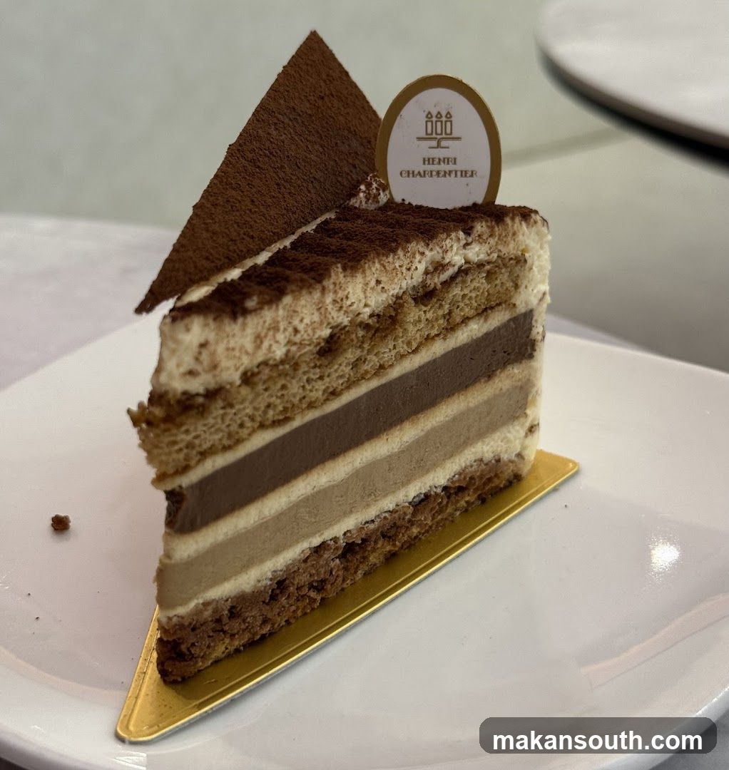 Slice of layered cake with chocolate and cream fillings