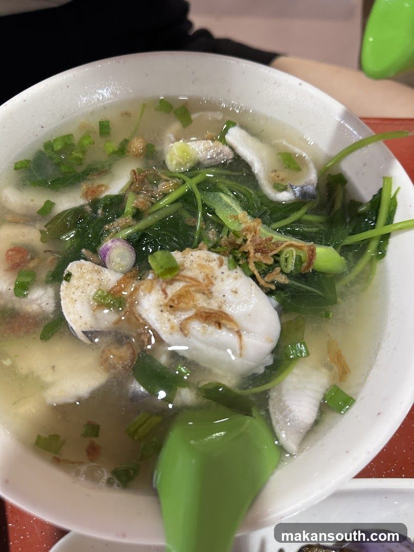 Bowl of Fish Soup with Greens