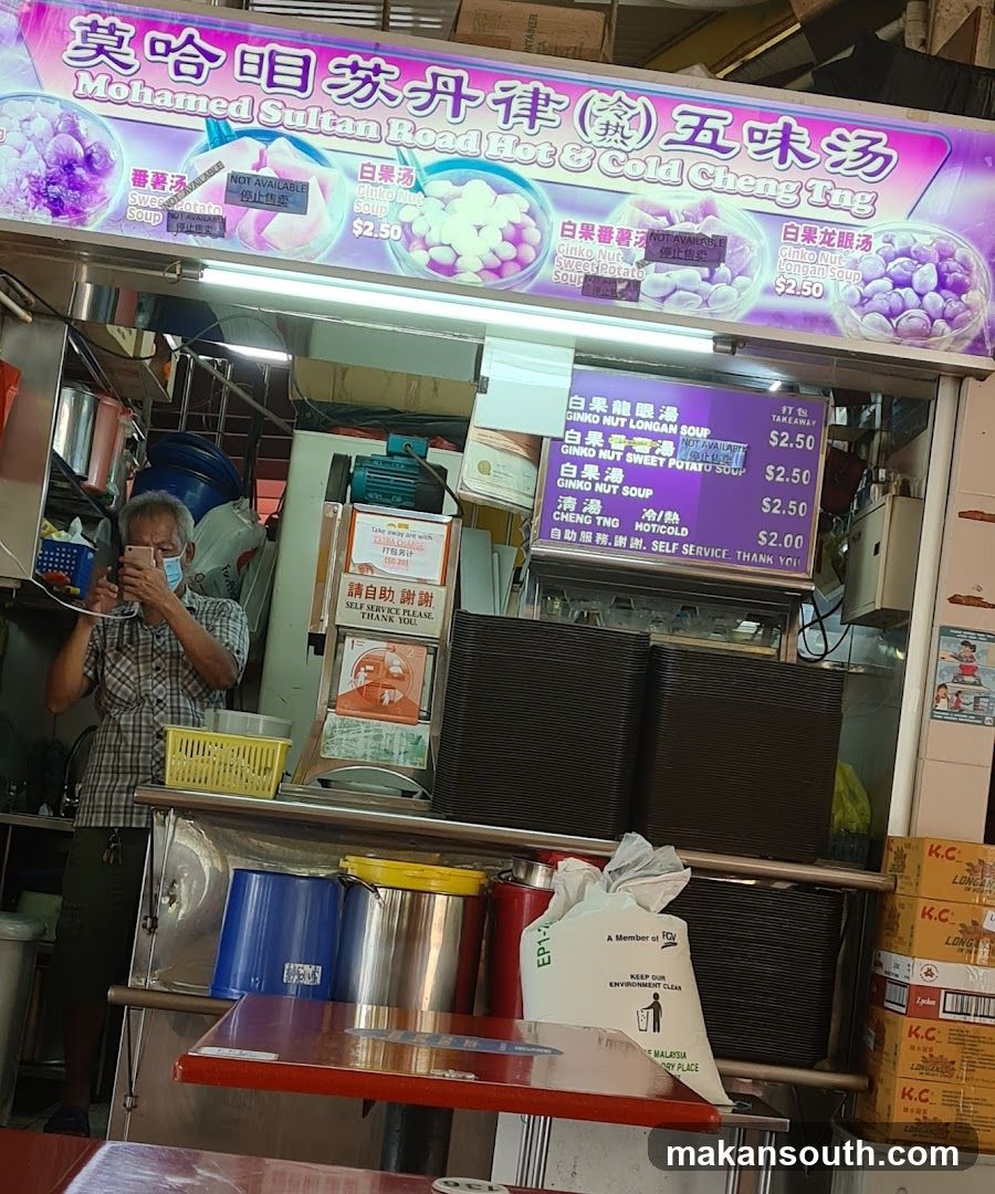 Food Stall Interior with Menu Board and Staff