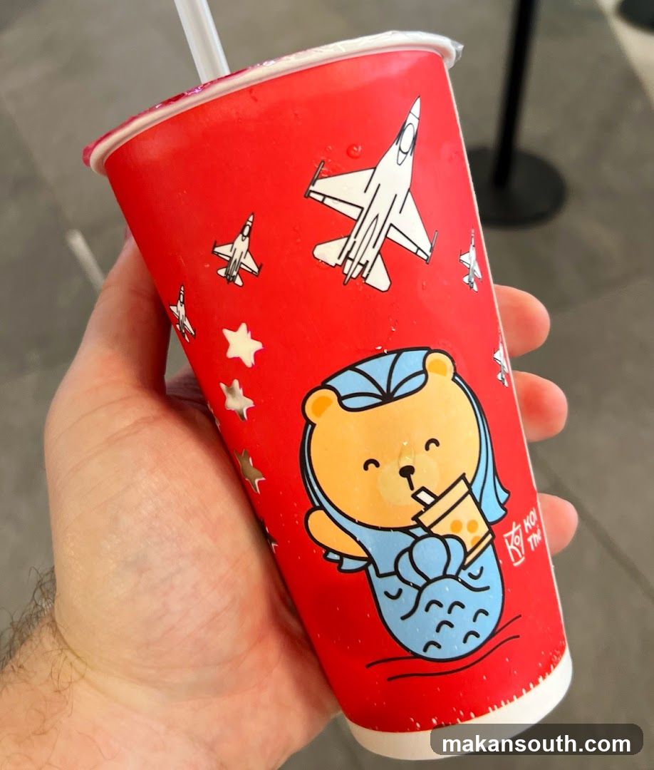 Red cup with cartoon bear and jets