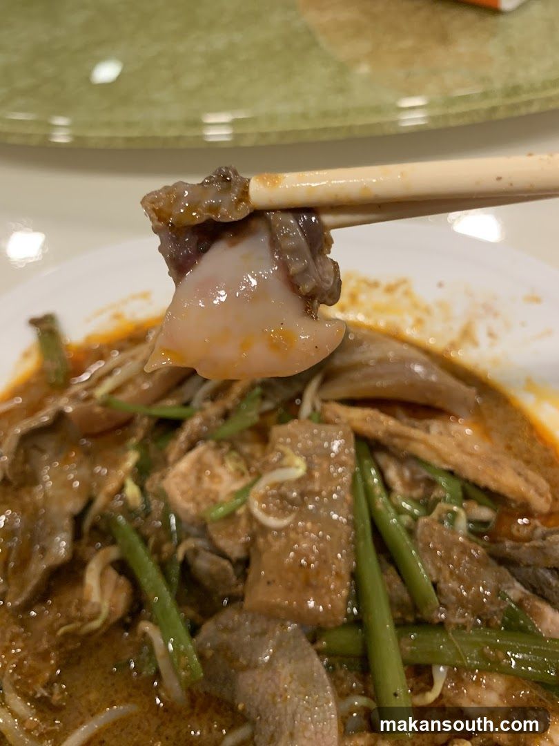 Spicy Meat Dish with Chopsticks