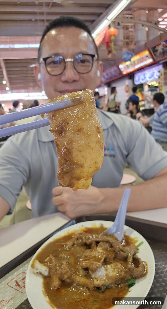 Man eating at food court