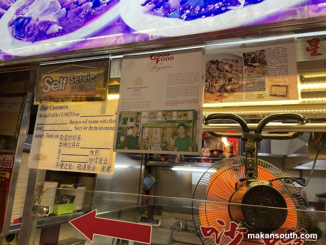 Food Stall Interior with Signs and Fan