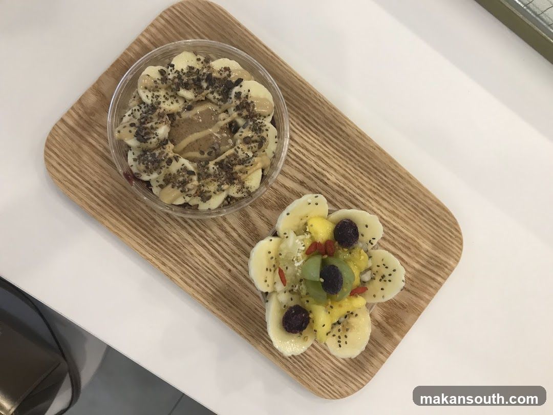 Fruit Bowl and Smoothie Bowls on Wooden Board