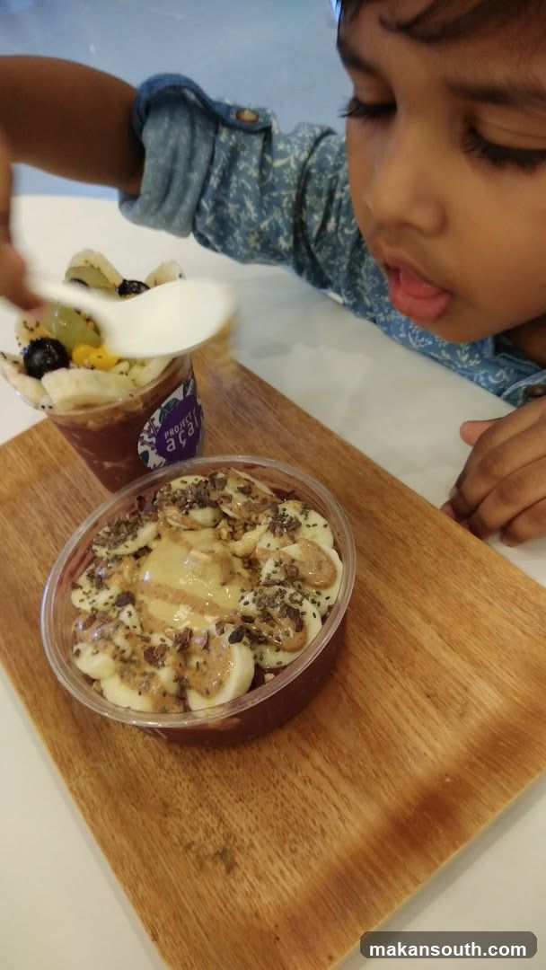 Child Eating Acai Bowl