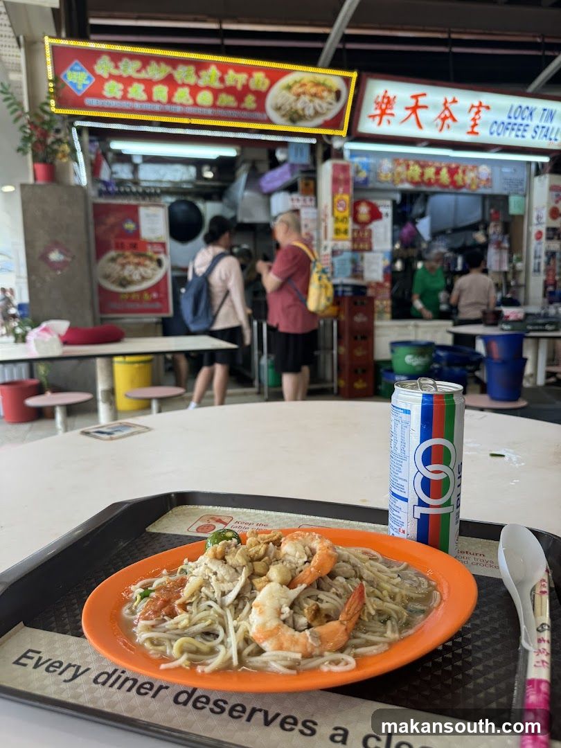 Food stall scene with noodles and drink