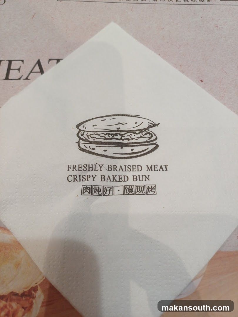 Napkin with food illustration and text