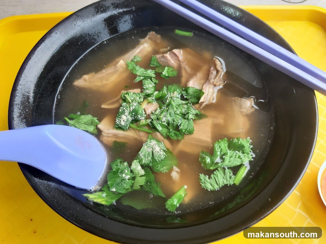 Bowl of Soup with Cilantro and Meat