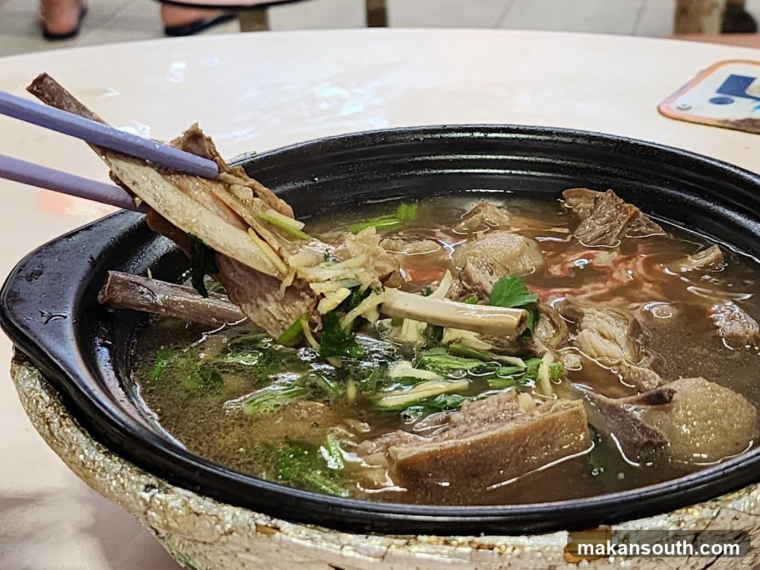 Pot of Meat Soup with Chopsticks