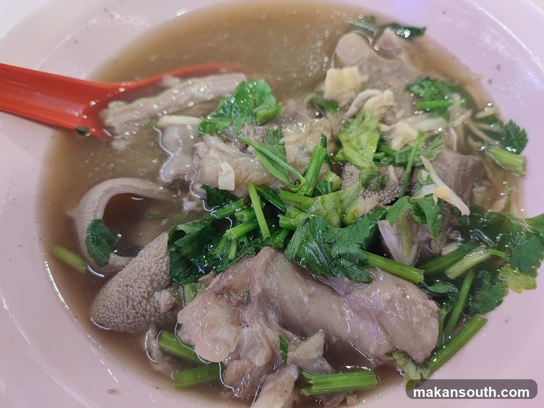 Bowl of Soup with Meat and Herbs